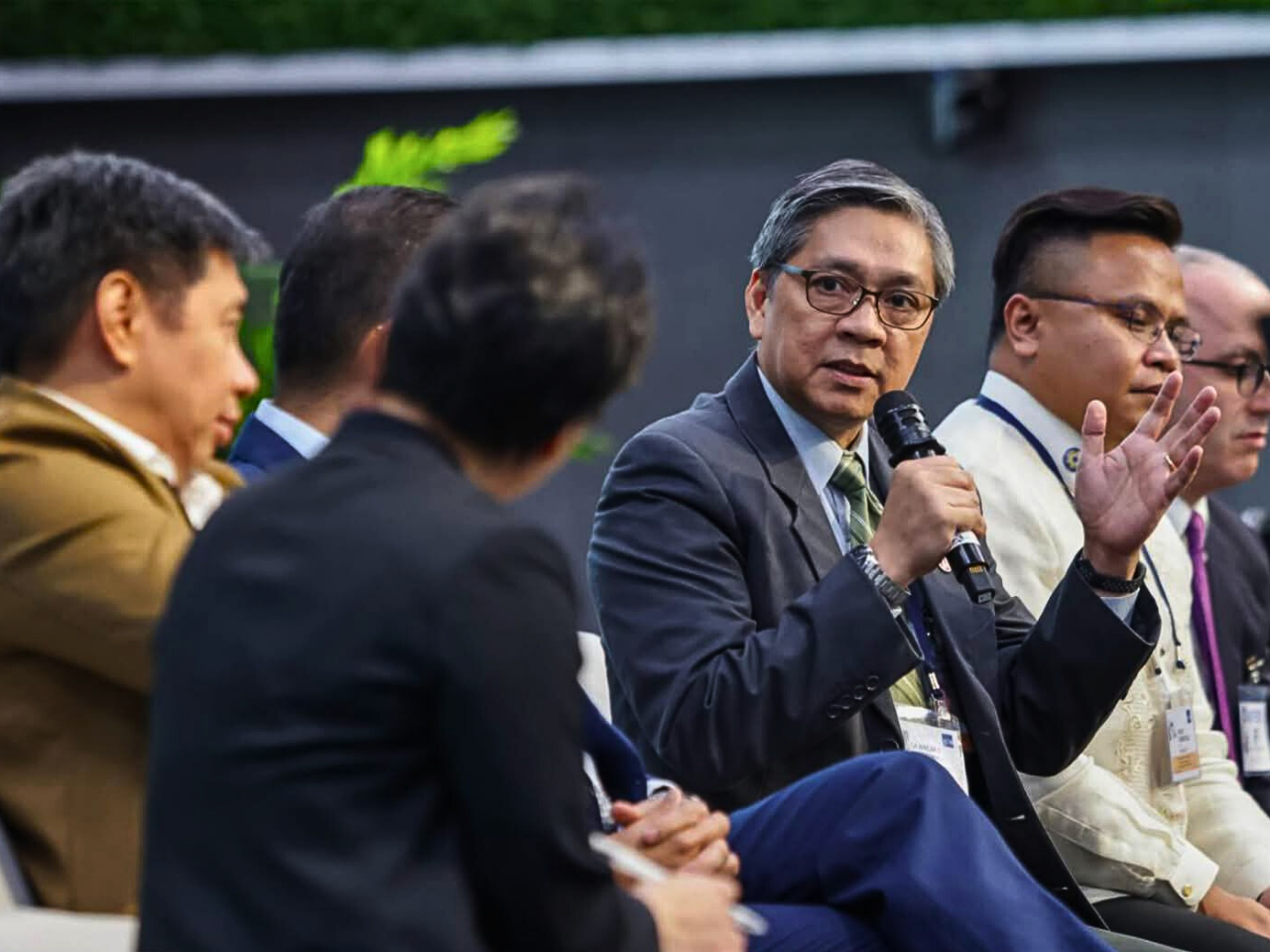 The image repesent the philippines, finance minister in public stage talk